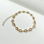 Gold filled crystal charm bracelet laid flat with extender chain