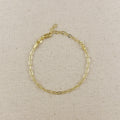 Gold filled paperclip link chain bracelet on linen