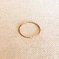 1mm gold filled plain stacking ring on linen