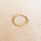 1mm gold filled plain stacking ring on linen
