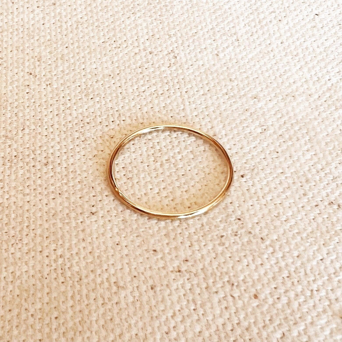 1mm gold filled plain stacking ring on linen