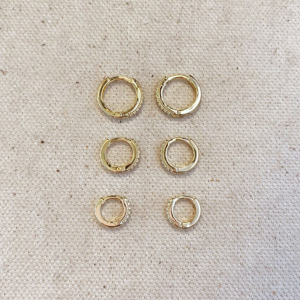 Pavé hoop earring trio in three sizes laid out on linen