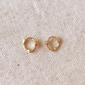 Starburst mini huggie hoops in gold filled on linen