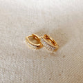 Pavé oval huggie hoops in gold filled on linen