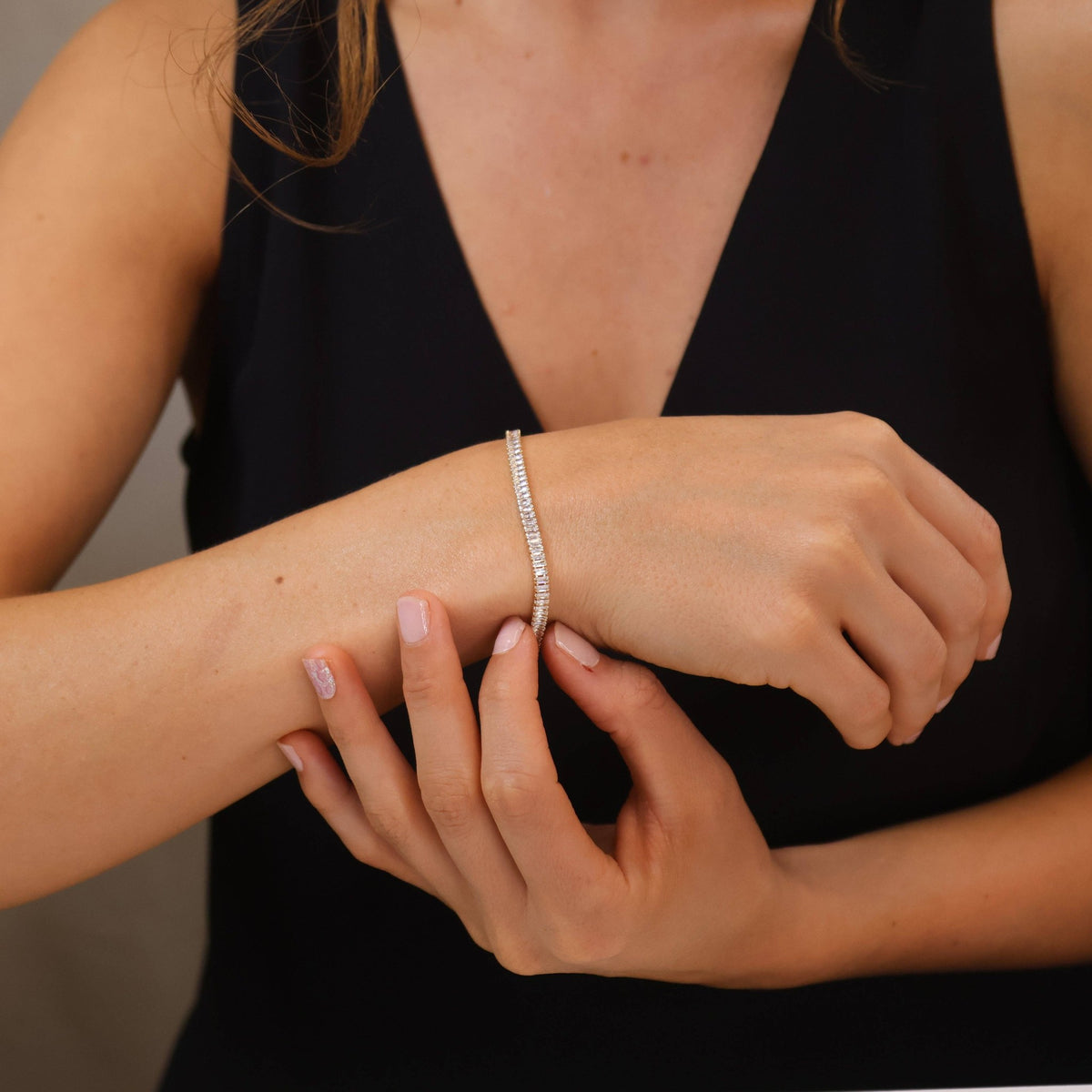 Baguette tennis bracelet worn on the wrist