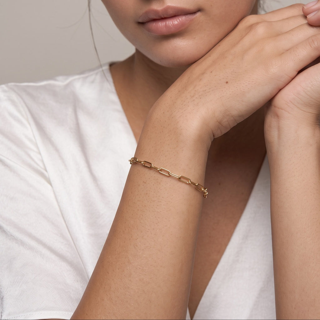 Paperclip chain bracelet worn on the wrist