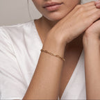 Paperclip chain bracelet worn on the wrist