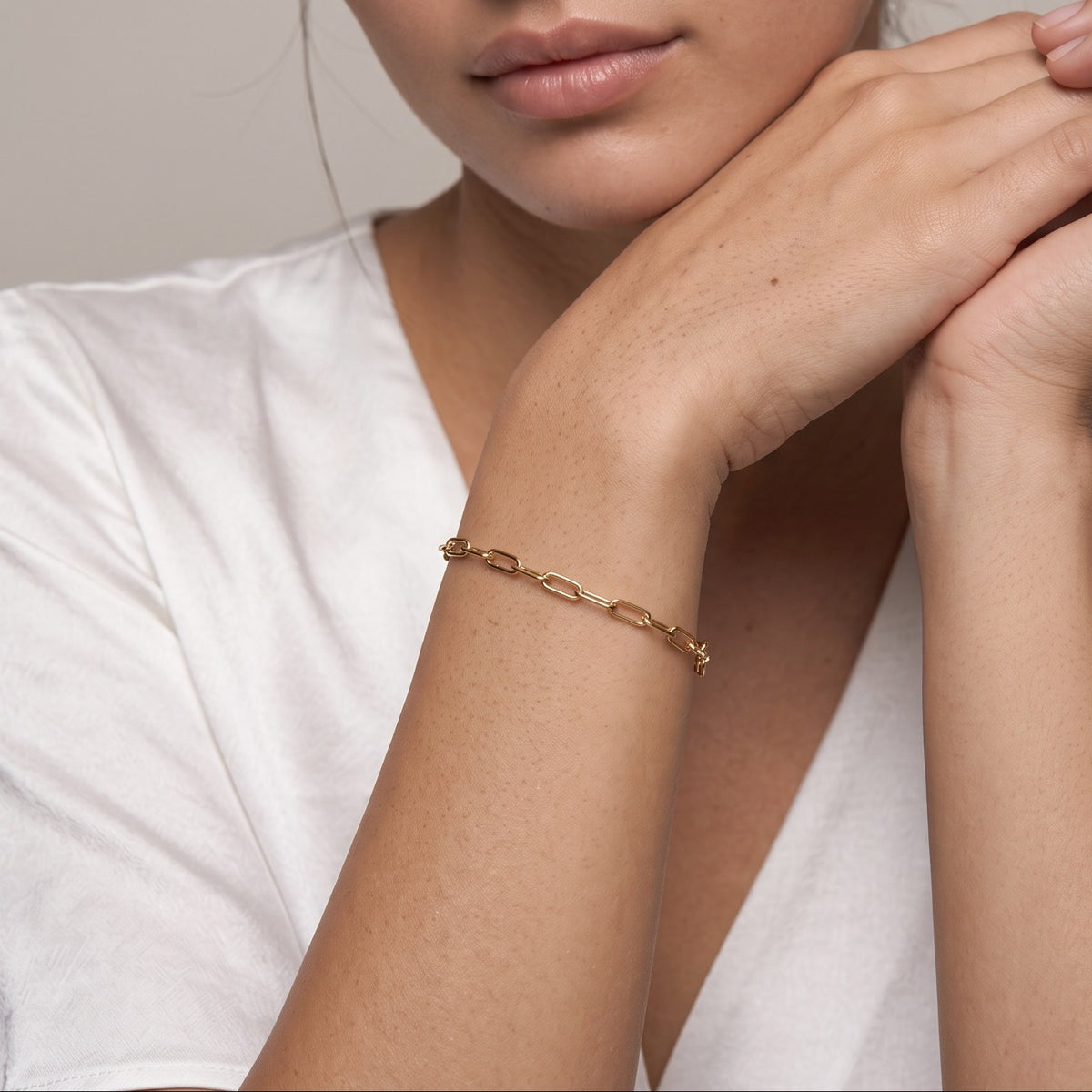 Paperclip chain bracelet worn on the wrist