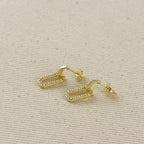 Gold filled link drop earrings laid flat on linen