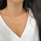 Gold filled paperclip necklace styled with an open collar