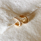 Oval clicker hoop earrings on a linen edge