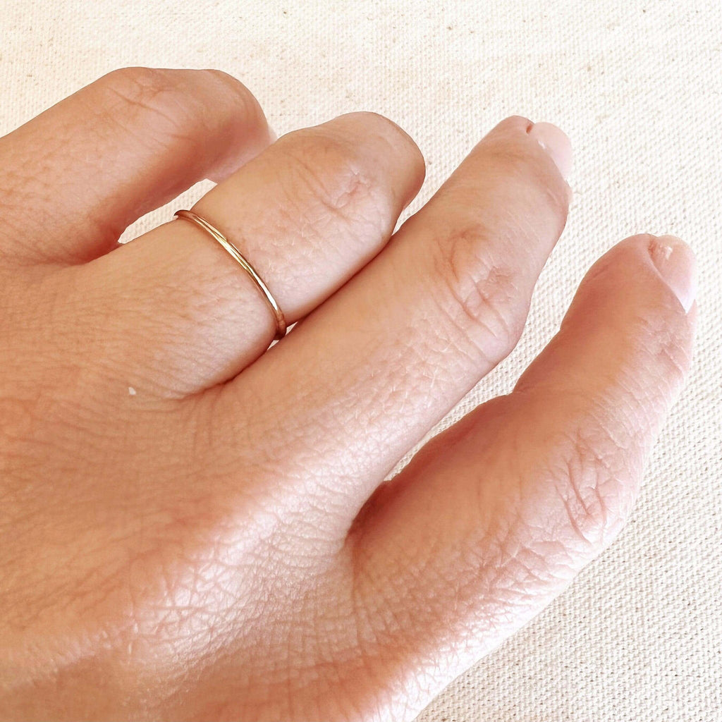 1mm gold band worn on the finger