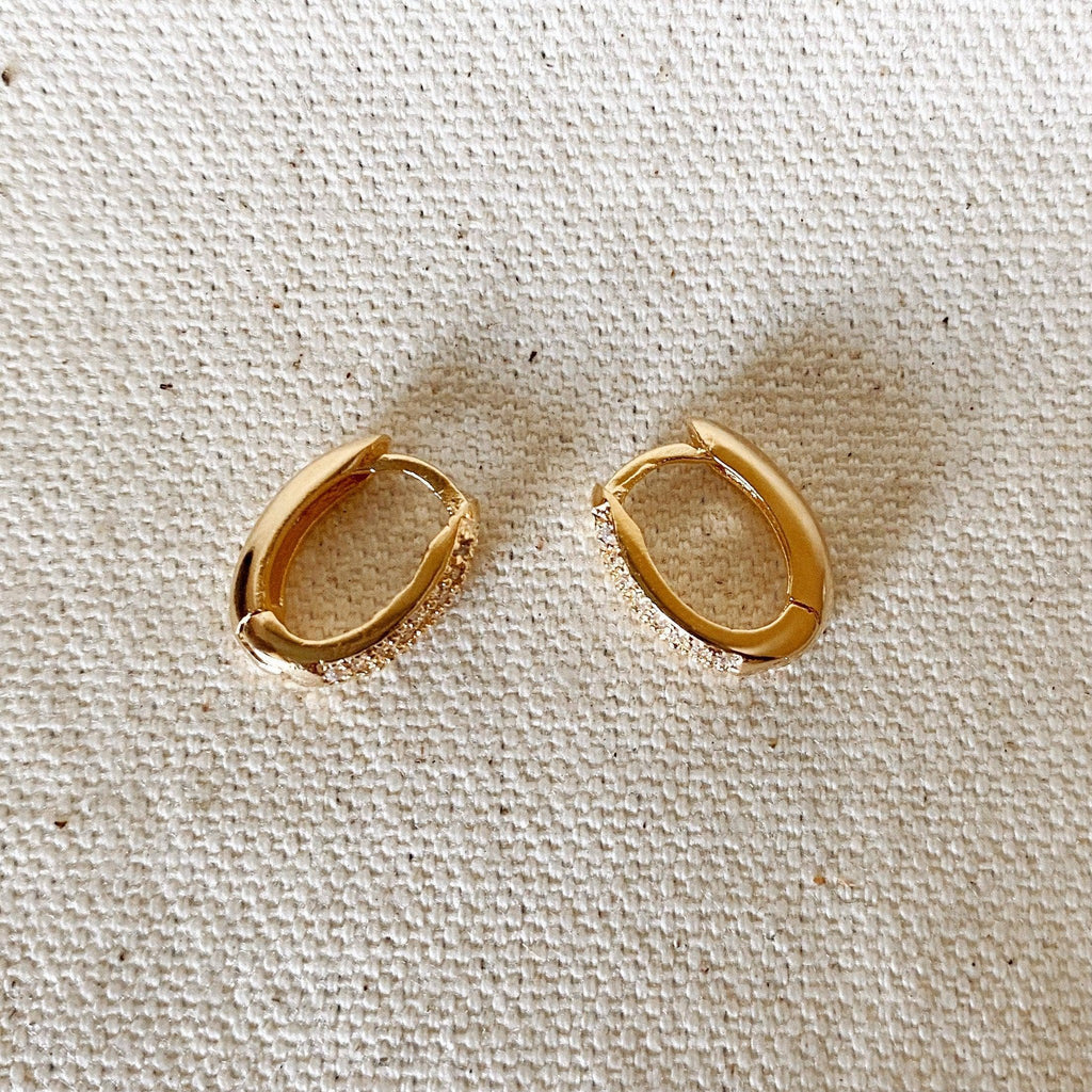 Pair of oval huggie hoops on linen