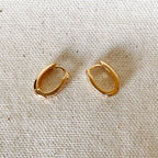 Pair of oval huggie hoops on linen