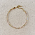 Gold filled marquise tennis bracelet with extender chain on linen