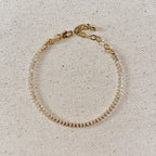 Gold filled marquise tennis bracelet with extender chain on linen