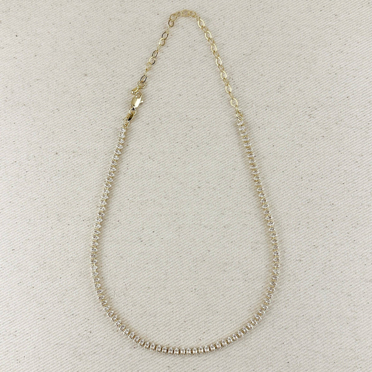 Gold filled marquise tennis necklace with extender chain on linen