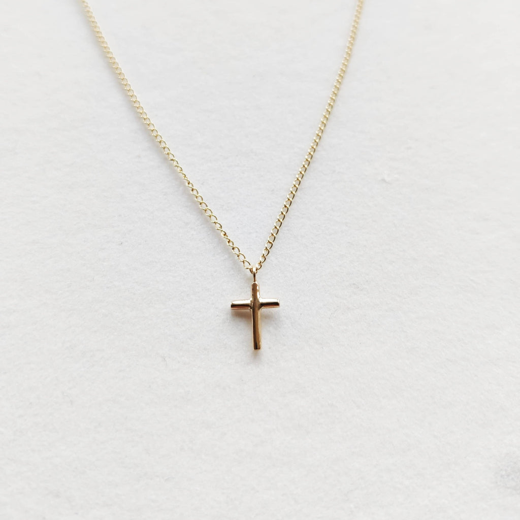 Petite cross necklace in 9ct yellow gold on a fine chain