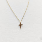 Petite cross necklace in 9ct yellow gold on a fine chain