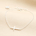 Sterling silver sideways cross bracelet on a fine cable chain